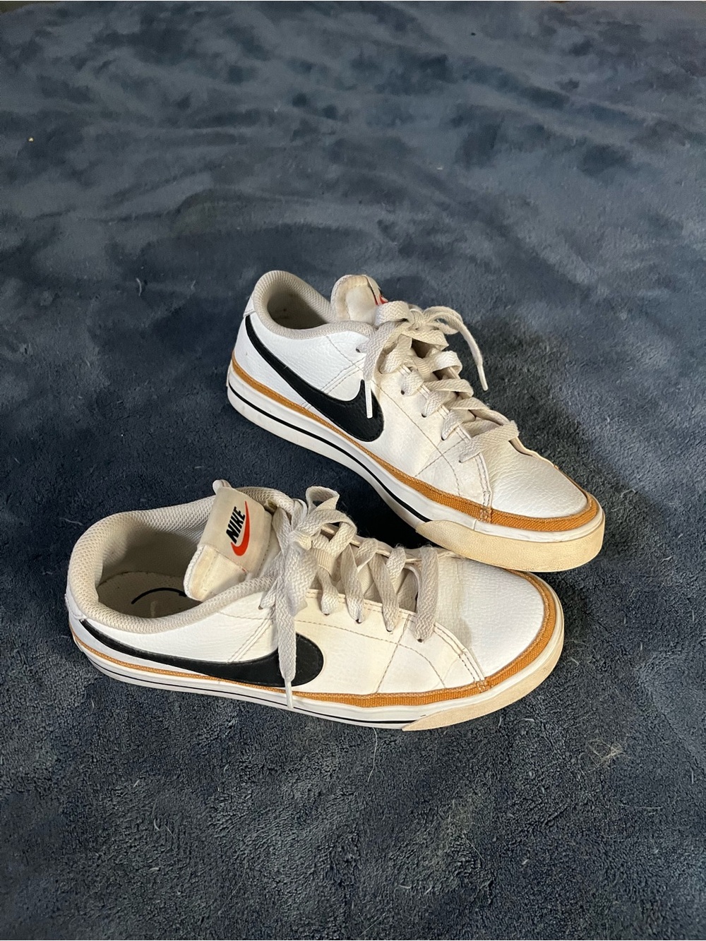 Nike Kids White Sneakers with Black Swoosh and Tan Accent